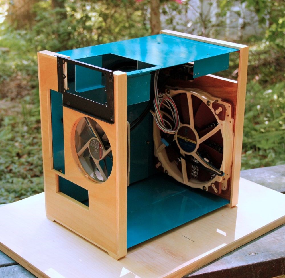 Homemade, 22g mild steel sides, 1/2" birch plywood front/back, 1/8" acrylic side panel